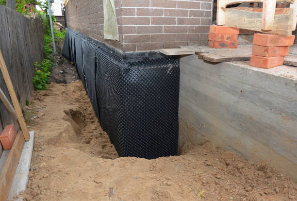 SJ Waterproofing Pros technician performing targeted Wet Basement Repair assessment in New Hope, AL